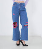 Jeans con strappi colorati