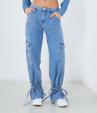 Jeans con lacci sul fondo