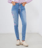 Jeans skinny con fiori