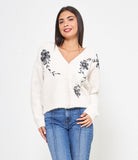 Cardigan con fiore